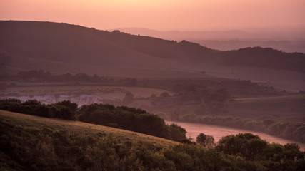 Hills in East Sussex with layers of mist viewed from Butts Brow in the South Downs National Park