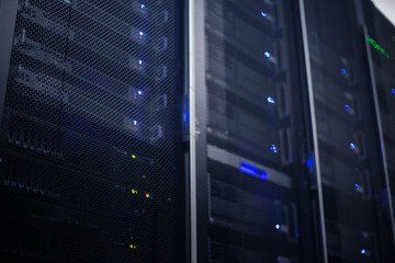 Rows of racks in a large data center. Technology Business Concept.