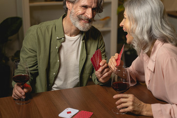 Laughing female looking at her cheerful man