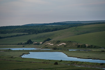 Fototapeta na wymiar River Cuckmere flowing through the East Sussex countryside