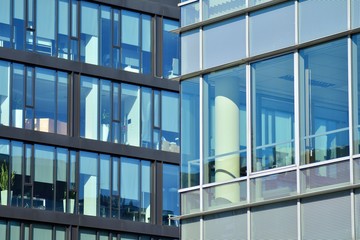 The windows of a modern building for offices. Business buildings architecture.