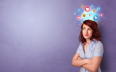 Business person standing with social media and emoticons concept