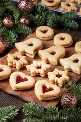 Linzer Christmas cookies filled with marmalade on a table