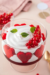 Red velvet cake in glasses for valentines day on a pink background. Valentine day.
