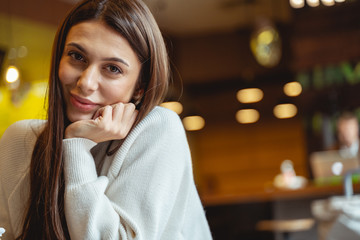 Portrait of pleased female that posing on camera