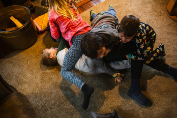 Kids wrestling in living room