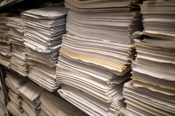 in a file archive there are shelves filled with mountains of files