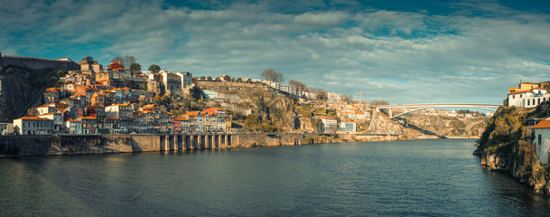 Fototapeta na wymiar panorama with old fishing houses on a hill next to the funicular in Ribeira district on the banks of the Douro River in the city of Porto in Portugal