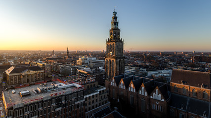 GRONINGEN - NETHERLANDS, December 30, 2019: Nice view over the city groningen. Martini toren en the Stadhuis - obrazy, fototapety, plakaty