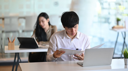 Obraz premium Portrait of Creative team working at the office. Modern office concept.