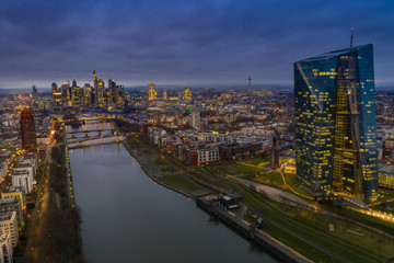 Fototapeta na wymiar The central bank in Frankfurt am Main. Aerial view at sunset towards the city of Frankfurt with a view to the central bank. 03.01.2020 Frankfurt am Main Germany.