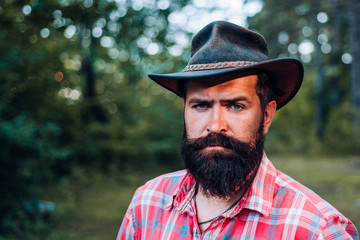 Hipster tourist explore forest. Fashion portrait man. Human and nature. Hispter style. Handsome...