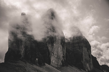 View of the three peaks of Lavaredo Veiled by clouds, from the Locatelli refuge