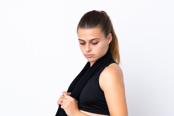 Teenager sport girl over isolated white background with sport towel