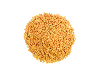 A round bunch of fenugreek on white isolated background. Indian cuisine, ayurveda, naturopathy concept