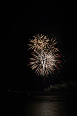 Fototapeta premium Festive fireworks over Marina del Rey channel to ring in the new year.
