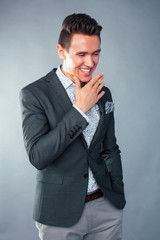 young pretty businessman posing emotional gesturing on white background, lifestyle people concept