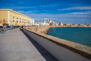 Fototapeta na wymiar Promenade of Cadiz with a view to Catedral de Cadiz