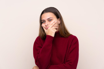 Teenager girl over isolated background thinking an idea