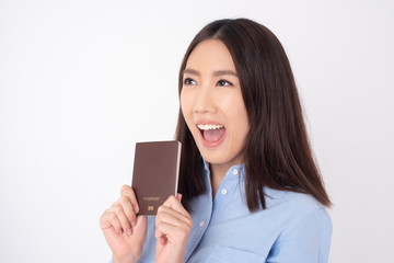 Fototapeta premium Beautiful Asian woman tourist is holding passport on white background