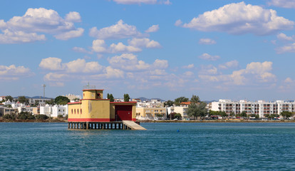 Landscape view from Fuseta, an old Portuguese city in the municipality of Olhão in the district of Faro, Algarve. View of the historical yellow life-guard building in Fuseta.