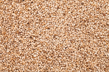 Lots of toasted sesame seeds at top view 