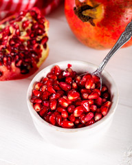 Bowl with pomegranate seeds on table