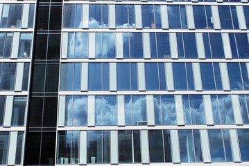 The windows of a modern building for offices. Business buildings architecture.