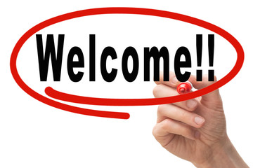 Male hand writing the word Welcome on whiteboard, highlighted with red circle