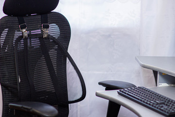Orthopedic lining under the back on an office chair.