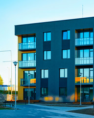 Apartment in residential building exterior. Housing structure at blue modern house of Europe. Rental home in city district on summer. Architecture for business property investment, Vilnius, Lithuania.