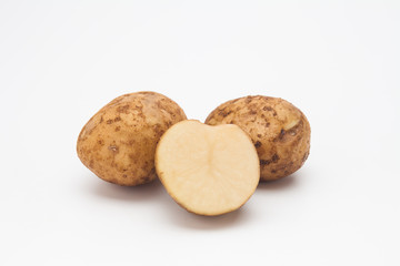 Sliced raw potatoes on a white background