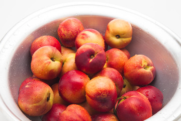 Many of ripe peaches on a basket 
