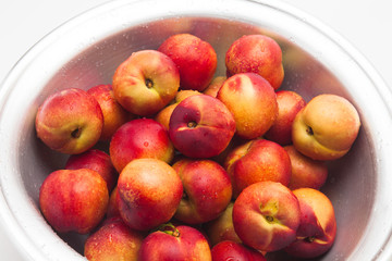 Many of ripe peaches on a basket 