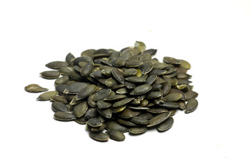 a pile of pumpkin seeds isolated on white background flat lay. Horizontal image