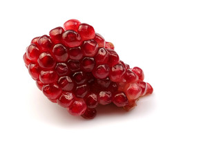 Fruit red pomegranate seeds, isolated on a white background, herbs, fruit kingdom.