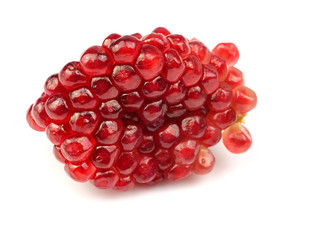 Fruit red pomegranate seeds, isolated on a white background, herbs, fruit kingdom.