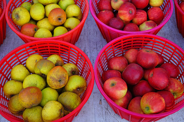 Baskets of fresh apples at a farmers market