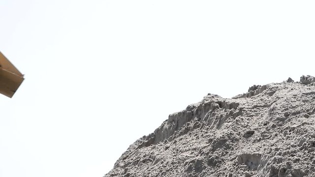 Close-up of excavator. Digger loads sand 