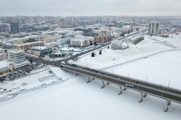 Fototapeta na wymiar view of the pioneer embankment of the Cheboksary Bay and the bridge over the Bay in Cheboksary in the winter