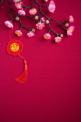 Chinese New Year decorations with red background with assorted festival decorations. Chinese characters means abundant of wealth, prosperity and luck. Flat lay or top view. 