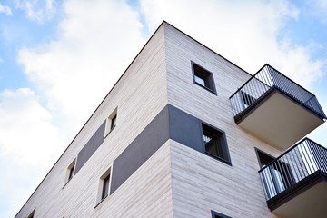 Modern apartment buildings on a sunny day with a blue sky. Facade of a modern apartment building.