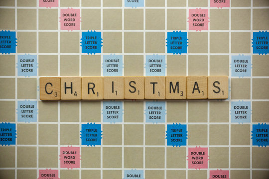 WOODBRIDGE, NEW JERSEY - November 9, 2018: Scrabble tiles spell out the word Christmas on a vintage game board