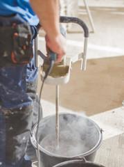 concrete electrical mixer during the work ; construction concept