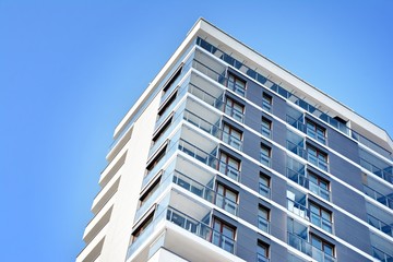 Modern apartment buildings on a sunny day with a blue sky. Facade of a modern apartment building.
