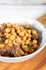 Chickpea stew dish on wooden board