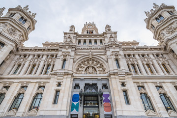 Fototapeta na wymiar Madrid, Spain - January 22, 2019: Front facade of Cybele Palace - City Council of Madrid capital city