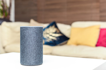 Smart speaker in modern home interior Voice controlled internet enabled device to listen to music and more