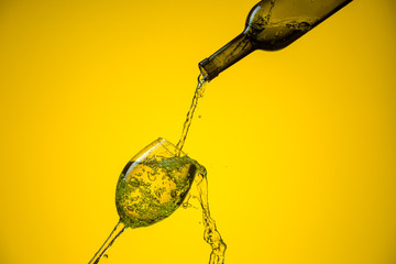 White wine is poured into a glass.