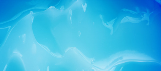 The creamy texture of the blue color. Cosmetic trendy background. macro.